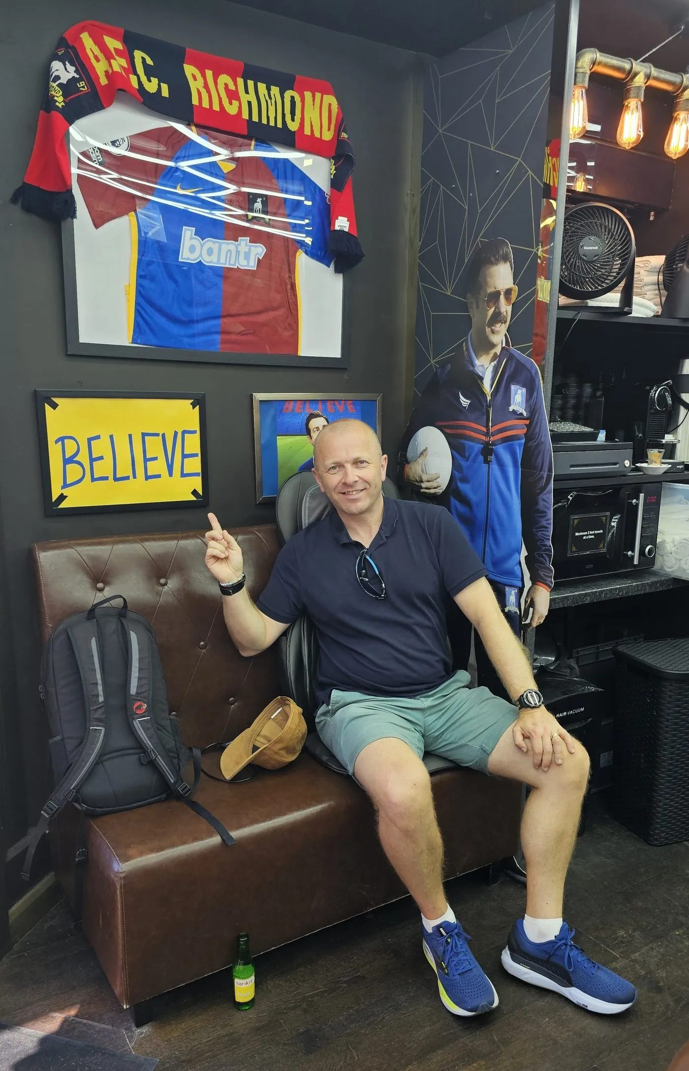 The BELIEVE sign in the barber shop featured in the series.